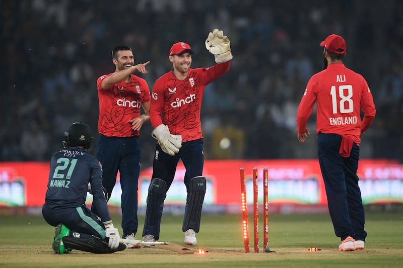 England after taking the wicket of Pakistan's Mohammad Nawaz at the Gaddafi Cricket Stadium in Lahore. AFP