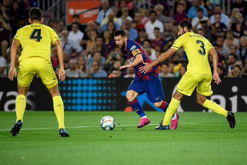 Barcelona's Argentine forward Lionel Messi vies with Villarreal's Spanish defender Raul Albiol. AFP