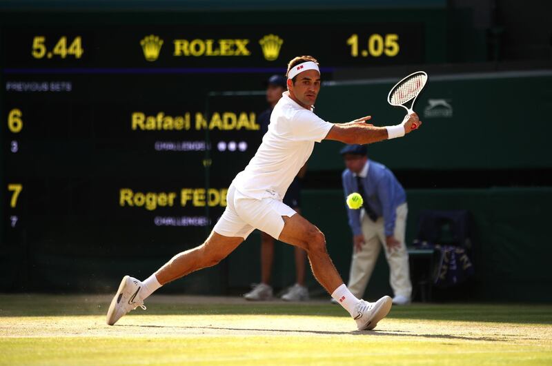 LONDON, ENGLAND - JULY 12: Roger Federer of Switzerland stretches to play a backhand in his Men's Singles semi-final match against Rafael Nadal of Spain during Day eleven of The Championships - Wimbledon 2019 at All England Lawn Tennis and Croquet Club on July 12, 2019 in London, England. (Photo by Clive Brunskill/Getty Images)