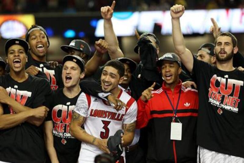 ATLANTA, GA - APRIL 08: Peyton Siva #3 (C) of the Louisville Cardinals celebrates with his teammates after they won 82-76 against the Michigan Wolverines during the 2013 NCAA Men's Final Four Championship at the Georgia Dome on April 8, 2013 in Atlanta, Georgia.   Streeter Lecka/Getty Images/AFP== FOR NEWSPAPERS, INTERNET, TELCOS & TELEVISION USE ONLY ==

