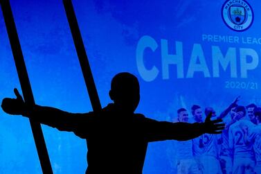 Supporters celebrate outside the Etihad Stadium after Manchester City clinched the Premier League title. AP