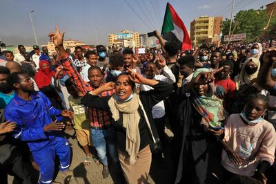 Sudanese protesters march in the Sudanese capital Khartoum, to denounce overnight detentions by the army of members of Sudan's government, on October 25, 2021. AFP