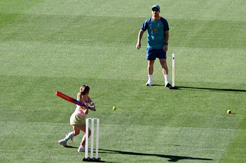 Australia's David Warner plays cricket with his family in Melbourne. AFP