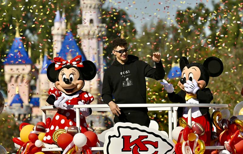 Kansas City Chiefs quarterback Patrick Mahomes greets fans during a cavalcade through Disneyland in Anaheim, California. The Chiefs beat the San Francisco 49ers on Sunday, to clinch the Super Bowl in Las Vegas. AP