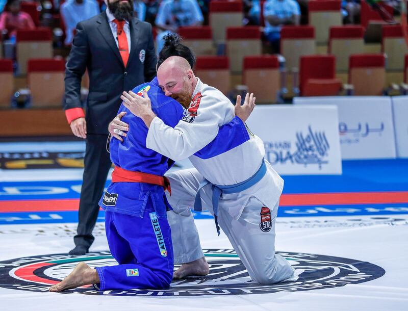 Abu Dhabi, UAE,  April 21, 2018.  AUH World Professional Jiu-Jitsu Championship. Final, Parajiu-Jitsu 8.   (red belt-Japan) Wataru Horie  and Ronald Mann( blue belt-USA). Give eachother a sportsmanship hug after the match.
Victor Besa / The National
Sports
Reporter: Amith Passela