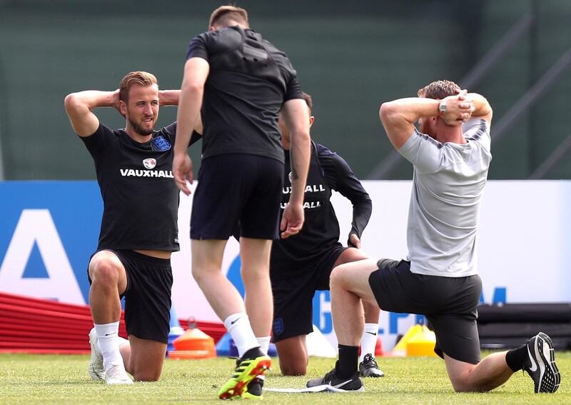 England captain Harry Kane, left, stretches. Alex Morton / Getty Images