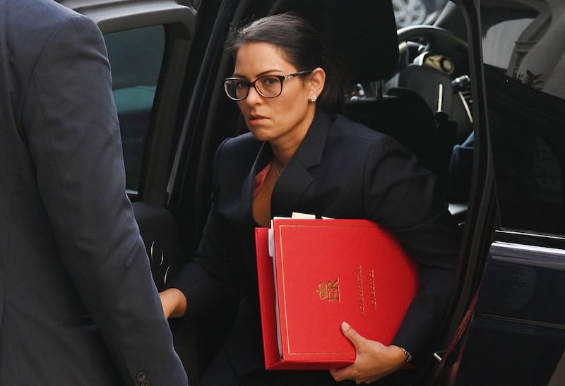 (FILES) In this file photo taken on September 22, 2020 Britain's Home Secretary Priti Patel arrives at the Foreign, Commonwealth and Development Office (FCDO) in central London on September 22, 2020 to attend the weekly meeting of the cabinet.  A Cabinet Office inquiry into allegations of bullying by Priti Patel has found evidence that she broke the ministerial code, informed sources said on November 20, 2020. / AFP / POOL / Leon Neal
