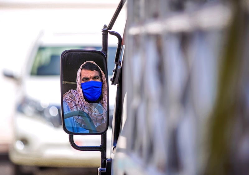 Abu Dhabi, United Arab Emirates, April 6, 2020.  A delivery driver wearing  a face mask at downtown Abu Dhabi.  UAE health ministry advised residents to wear a mask when they are outside, whether they are showing symptoms of Covid-19 or not.
Victor Besa / The National
Section:  NA
Reporter: