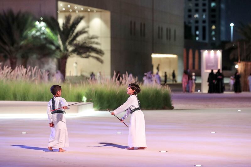 Children attend the festival in traditional clothing.