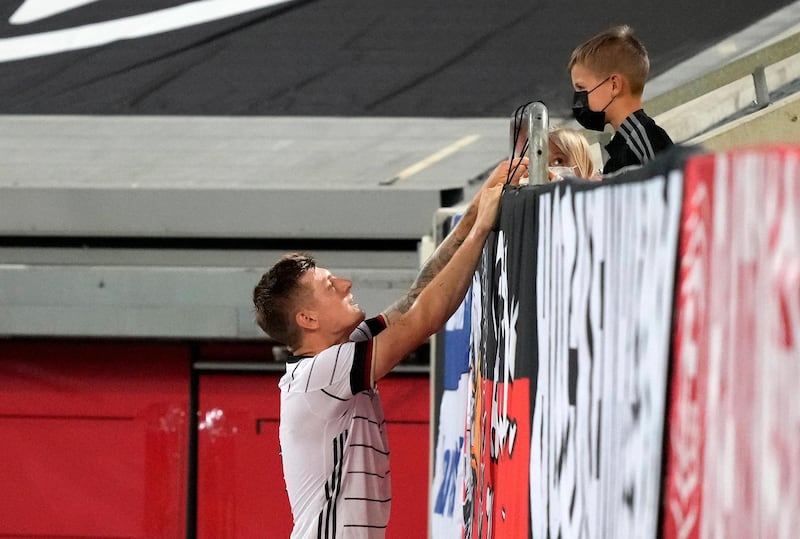Germany's Toni Kroos talks to his children in Duesseldorf. AP