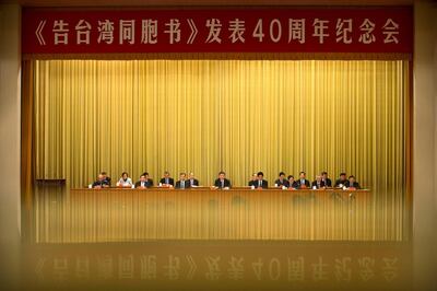 A banner is reflected on a polished surface as Chinese President Xi Jinping (C) speaks during an event to commemorate the 40th anniversary of the "Message to Compatriots in Taiwan" at the Great Hall of the People in Beijing, China January 2, 2019. REUTERS/Mark Schiefelbein/Pool     TPX IMAGES OF THE DAY