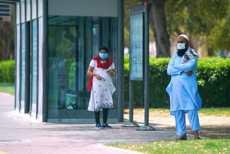 Abu Dhabi, United Arab Emirates, May 25, 2020.  
    Abu Dhabi residents waiting for their bus on Sultan Bin Zayed the First Street, Abiu Dhabi, during the Covid-19 pandemic.
Victor Besa  / The National
Section:  Standalone / Stock