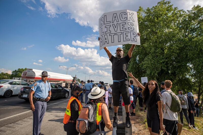 Georgia State Patrol troopers work to keep protesters off the Interstate 75-85 Downtown Connector highway. EPA