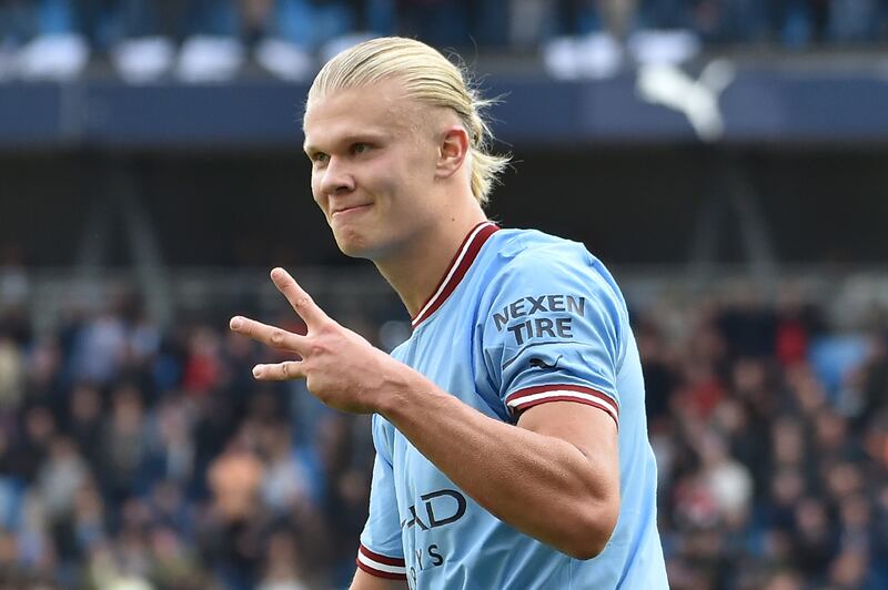 City's Erling Haaland celebrates after completing his hat-trick. AP