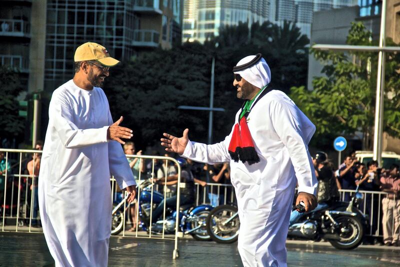 RUNNER-UP: ‘Happiness and National Pride’ by Beerta Maini, the US. "I attended the UAE National Day Parade in Downtown Dubai. In this photograph I was able to capture the national pride and joy of two Emiratis sharing their heritage."