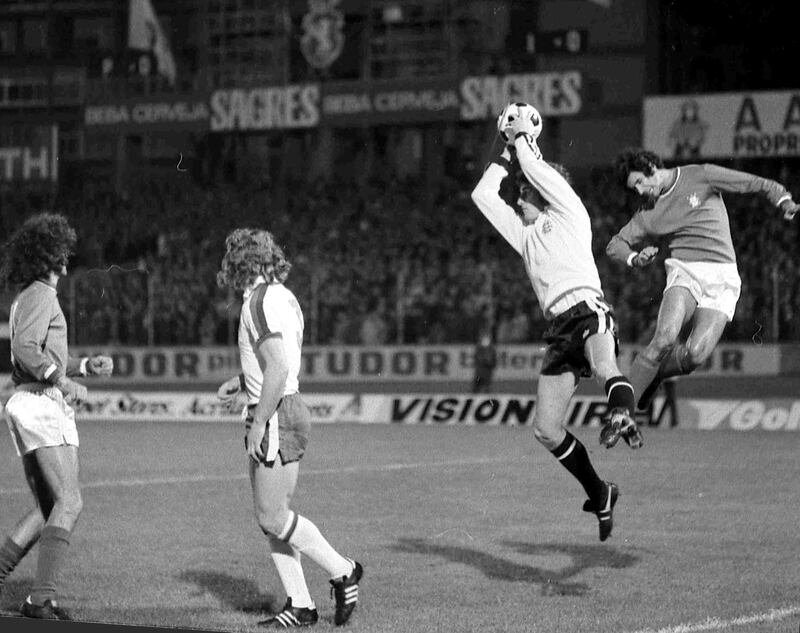 In this November 19, 1975 file photo, England's goalkeeper Ray Clemence, second right, saves the ball from an attacking Portuguese player during the European Nations Cup match in Lisbon, Portugal. AP Photo