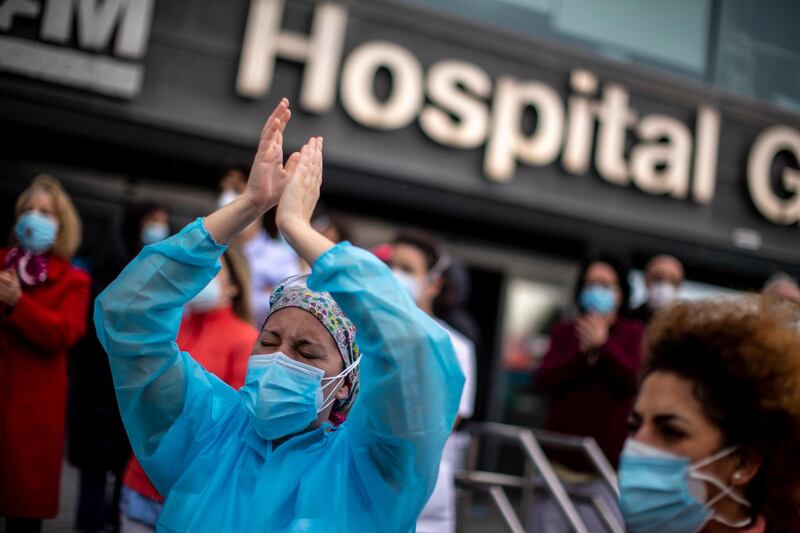 Healthcare workers protest against plans by Madrid's authorities to force staff to transfer to other hospitals at La Paz hospital in Madrid, Spain. AP Photo