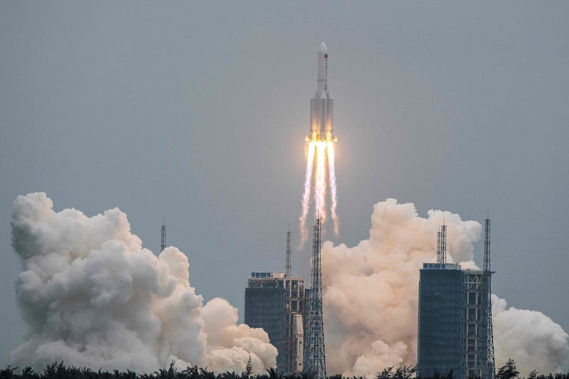 (FILES) This file photo taken on April 29, 2021 shows a Long March 5B rocket, carrying China's Tianhe space station core module, lifting off from the Wenchang Space Launch Center in southern China's Hainan province. A large segment of the Long March 5B rocket re-entered the Earth's atmosphere and disintegrated over the Indian Ocean, state television reported on May 9, 2021 citing the China Manned Space Engineering Office, following fevered speculation over where the 18-tonne object would come down. - China OUT
 / AFP / STR

