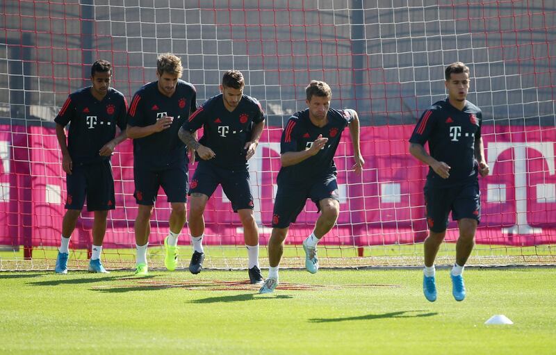 Bayern Munich's Philippe Coutinho with Thomas Muller and teammates during training. Reuters