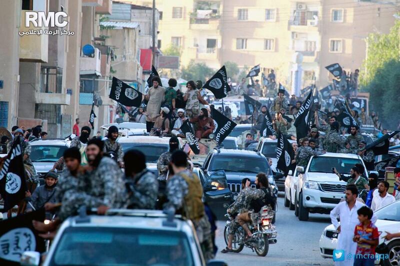 ISIL fighters in their Syrian stronghold of Raqqa, in a photo released by the extremists’ Raqqa Media Center on June 30, 2014. Raqqa Media Center / AP Photo