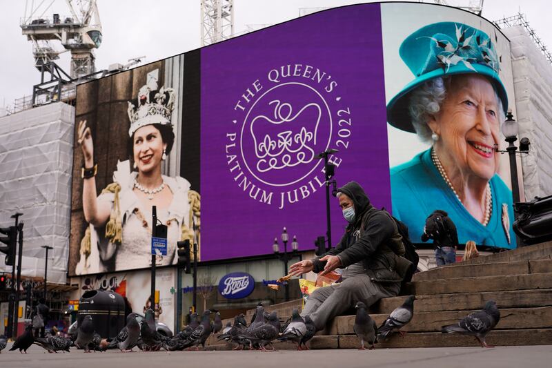 The screen in Piccadilly Circus, London, celebrates the 70th anniversary of Queen Elizabeth II's accession to the throne. AP