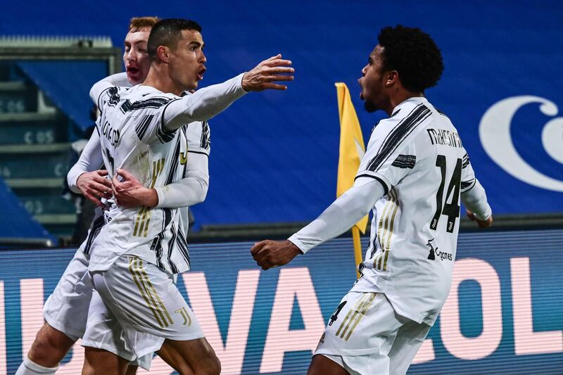 Juventus'  Cristiano Ronaldo celebrates with Dejan Kulusevski and Weston McKennie. AFP