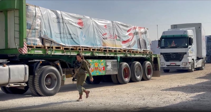 Lorries carrying humanitarian aid queue at the Rafah border crossing between Egypt and Gaza. Reuters