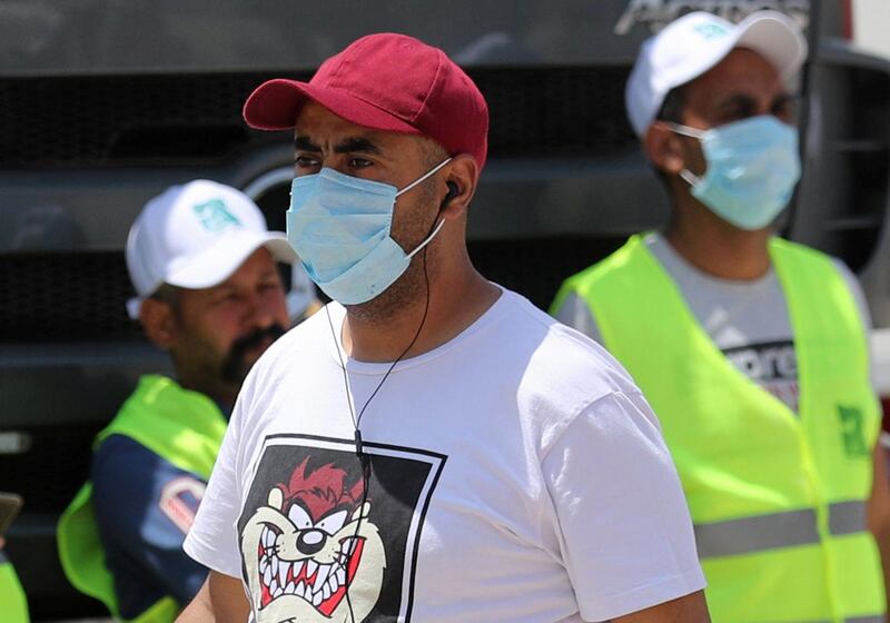 Men wearing protective face masks are pictured in downtown Cairo, amidst concerns about the spread of the coronavirus disease. Reuters