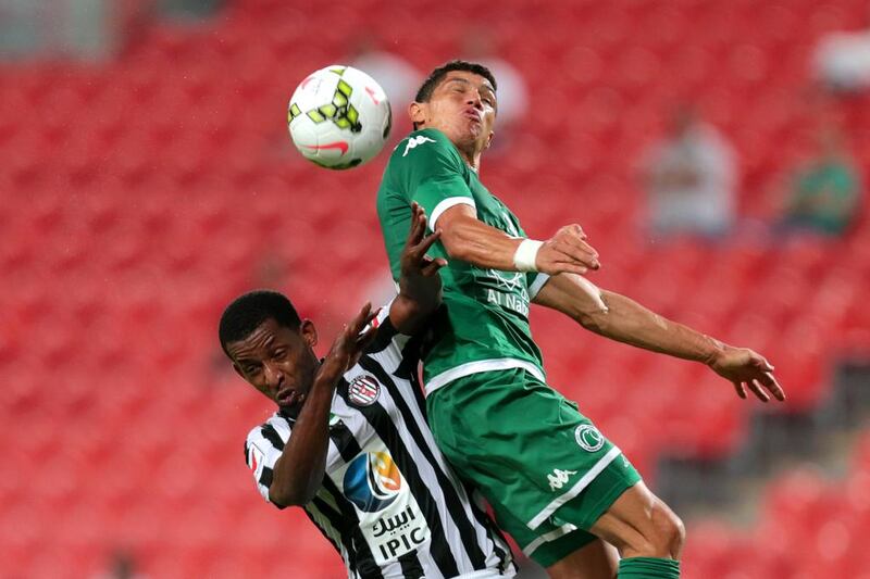 Al Jazira’s Basheer Saeed and Al Shabab’s Henrique Luvannor battle for the ball during an Arabian Gulf League match at Mohammed bin Zayed stadium in Abu Dhabi on May 1, 2015. Christopher Pike / The National