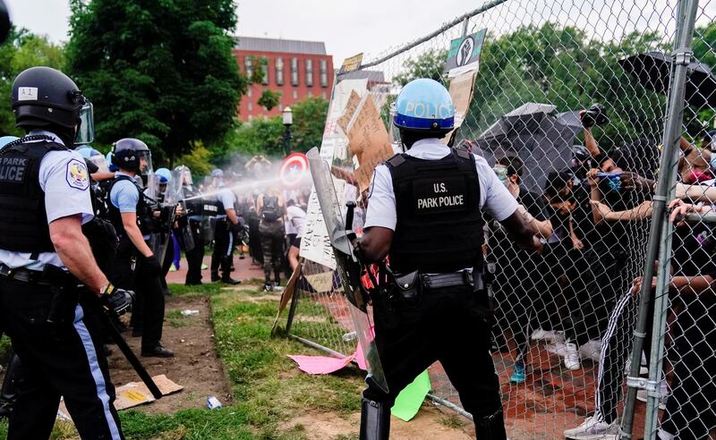 US Park Police officers fire pepper spray in Lafayette Park, Washington, DC. Reuters
