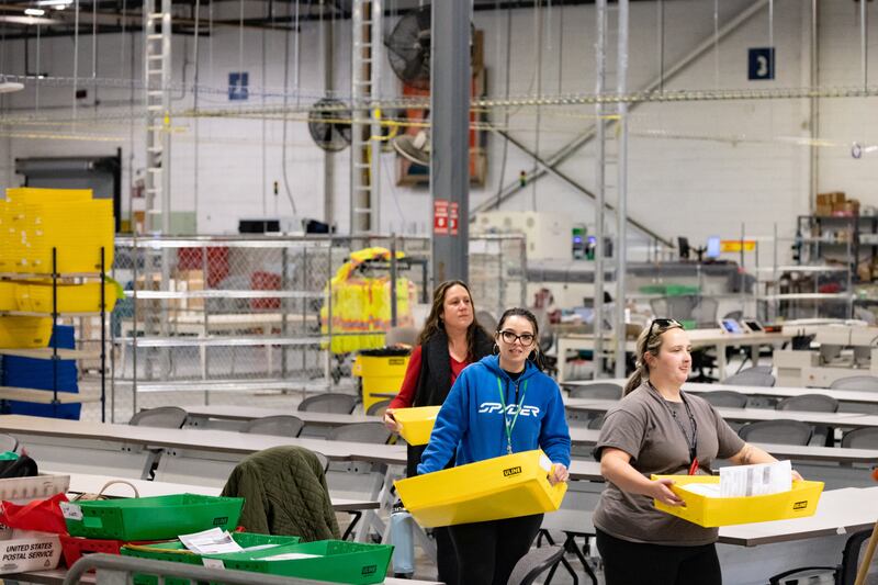 Ballots are carried to be scanned in Philadelphia. Reuters