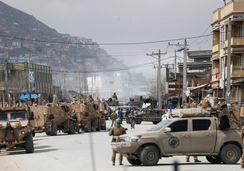 Afghan security forces inspect near the site of an attack in Kabul, Afghanistan. REUTERS