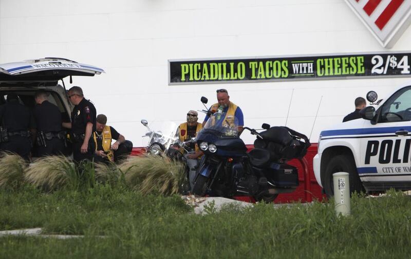 Three ‘biker gang members’ were arrested trying to enter the crime scene, said Waco police Sgt Patrick Swanto. John L Mone/AP Photo