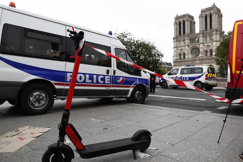 French police and security forces establish a security perimeter near Paris police headquarters. EPA