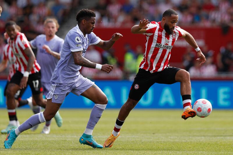 Brentford's Bryan Mbeumo under pressure from Junior Firpo of Leeds. AFP