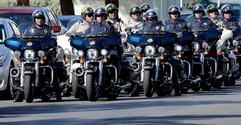 Motorcycle police line up after escorting US President Donald Trump to University Medical Center to meet with hospital personnel and victims of the mass shooting at the Route 91 Harvest Festival in Las Vegas, Nevada. Paul Buck / EPA