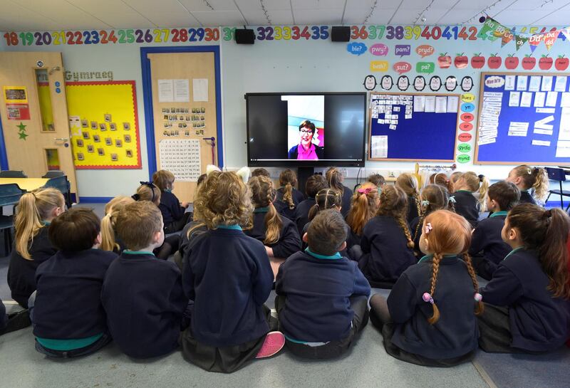 Pupils listen to an on-screen teacher at Ysgol Hafan Y Mor school. Reuters