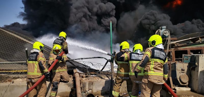 Fire crews battle a blaze at a plant that processes waste oil products in Jebel Ali Industrial Area.