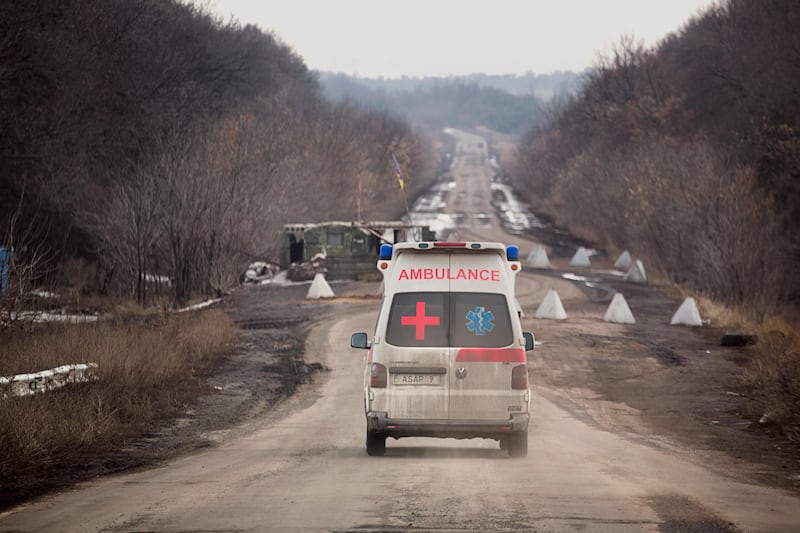 Julia Paevska’s ambulance is travelling towards a checkpoint set up by the army on the road between Bakhmut and Luhanske, near the frontline in eastern Ukraine. *** Local Caption ***  rv22ap-cover story5.jpg