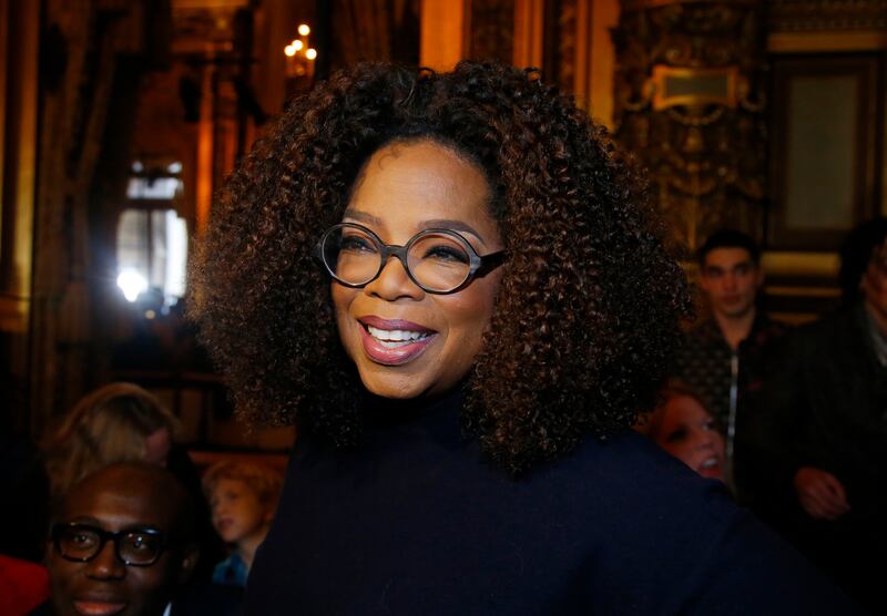 FILE - This March 4, 2019 file photo shows Oprah Winfrey at the presentation of Stella McCartney's ready-to-wear Fall-Winter 2019-2020 fashion collection in Paris. Winfrey says sheâ€™s giving $13 million to increase a scholarship endowment at Morehouse College in Atlanta, a historically black college. (AP Photo/Michel Euler, File)