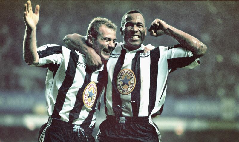 NEWCASTLE UPON-TYNE, UNITED KINGDOM - OCTOBER 20: Newcastle strikers Alan Shearer (l) and Les Ferdinand celebrate the fourth goal scored by Shearer during the Premier League match between Newcastle United and Manchester United at St Jame's Park on October 20, 1996 in Newcastle, England, Newcastle won the game 5-0. (Photo by Ben Radford/Allsport/Getty Images/Hulton Archive)