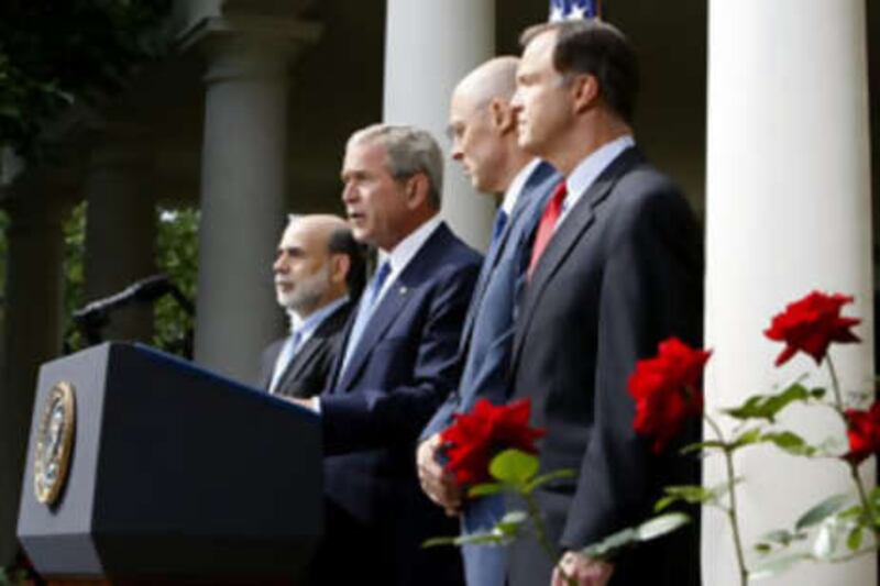 President Bush, second from left, accompanied by, from left, Federal Reserve Chairman Ben Bernanke, Treasury Secretary Henry Paulson, and Securities and Exchange Commission (SEC) Chairman Christopher Cox in the Rose Garden of the White House in Washington.