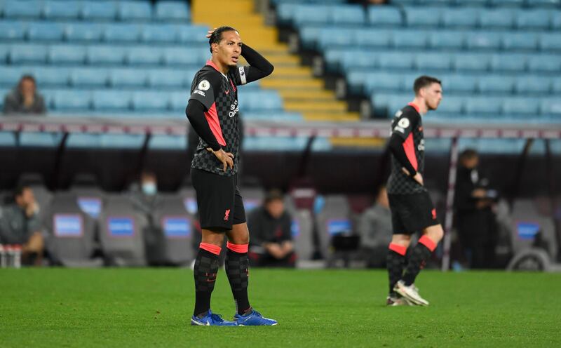 BIRMINGHAM, ENGLAND - OCTOBER 04: Virgil van Dijk of Liverpool reacts after Aston Villa score their 7th goal during the Premier League match between Aston Villa and Liverpool at Villa Park on October 04, 2020 in Birmingham, England. Sporting stadiums around the UK remain under strict restrictions due to the Coronavirus Pandemic as Government social distancing laws prohibit fans inside venues resulting in games being played behind closed doors. (Photo by Peter Powell - Pool/Getty Images)