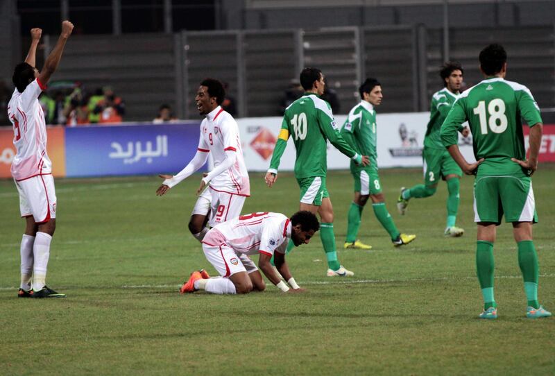 United Arab Emirates players, left, celebrate at the end of their match against Iraq, in the Gulf Cup final Friday, Jan.18, 2013, in Rifa, Bahrain. United Arab Emirates beat Iraq 2-1 in extra time on Friday to claim its second Gulf Cup title. (AP Photo/Hasan Jamali) *** Local Caption ***  Bahrain Gulf Cup.JPEG-06ecb.jpg