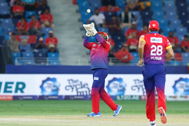 Dubai Capitals' Robin Uthappa takes a catch to dismiss Wanindu Hasaranga of Desert Vipers.