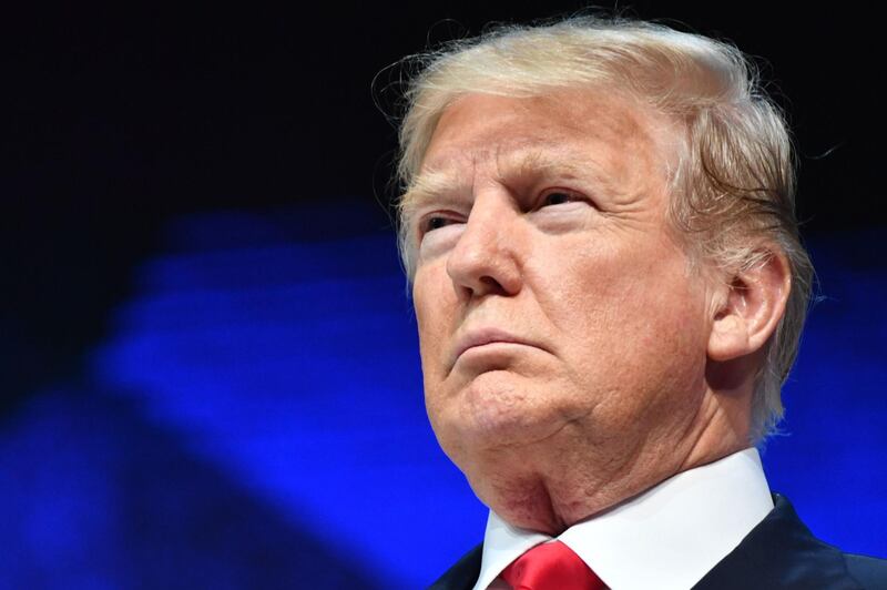 US President Donald Trump looks on before delivering a speech during the World Economic Forum (WEF) annual meeting on January 26, 2018 in Davos, eastern Switzerland. / AFP PHOTO / Nicholas Kamm