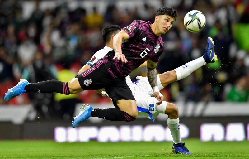 Mexico's Jorge Sanchez goes for a heaader against El Salvador. AFP