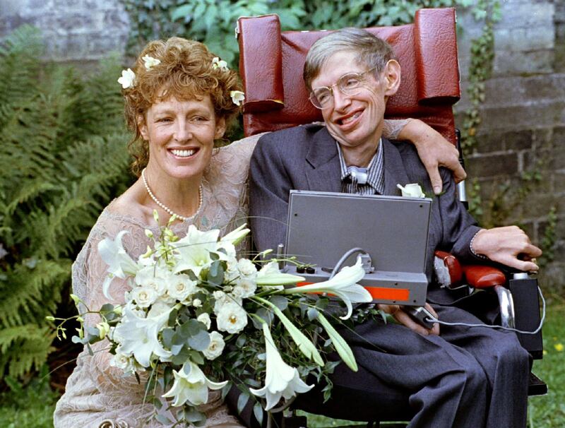 Stephen Hawking and his new bride Elaine Mason pose for pictures after the blessing of their wedding at St Barnabus Church on September 16, 1995. Russell Boyce / Reuters