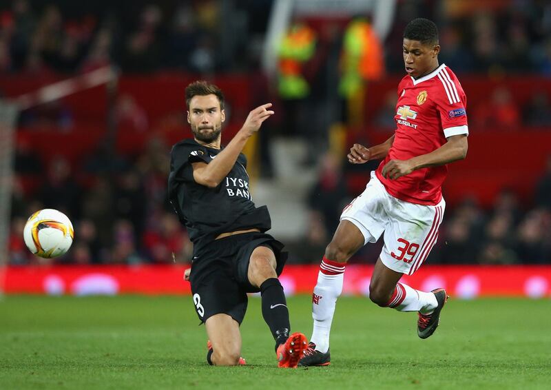 MANCHESTER, ENGLAND - FEBRUARY 25:  Marcus Rashford of Manchester United and Tim Sparv of FC Midtjylland compete for the ball during the UEFA Europa League Round of 32 second leg match between Manchester United and FC Midtjylland at Old Trafford on February 25, 2016 in Manchester, United Kingdom.  (Photo by Alex Livesey/Getty Images)