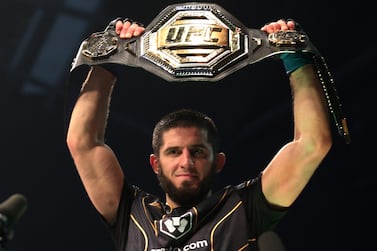Mixed Martial Arts - UFC 280 - Etihad Arena, Abu Dhabi, United Arab Emirates - October 23, 2022  Islam Makhachev celebrates with the belt after winning his fight against Charles Oliveira REUTERS / Christopher Pike